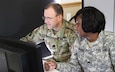 Lt. Col. Paul West (left) and Sgt. Katavia Parker, both Soldiers with the 75th Training Command, Gulf Training Division out of Birmingham, Ala., work side by side on the formation of training plans as part of the Exercise Cyber Shield 17 multi-service training exercise conducted at Camp Williams, Utah, on May 2, 2017. Exercise Cyber Shield 17 is the sixth iteration of this training exercise and this year unites the Army National Guard with members of the Air National Guard, Army Reserve, and civilians from private companies, state government agencies, federal agencies, industry partners, and academia. (U.S. Army Reserve photo by Spc. Christopher Hernandez)
