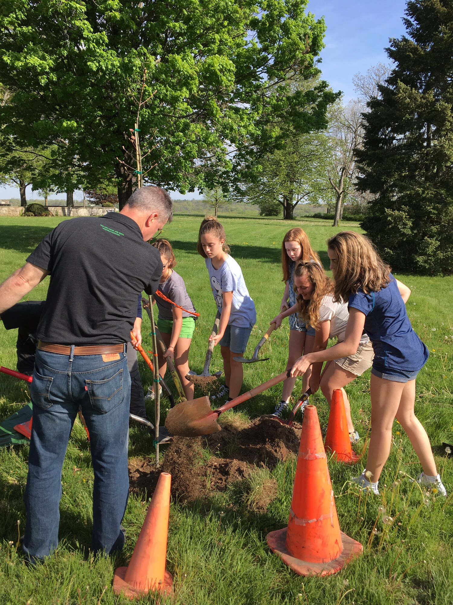 Honor Society students from Baker Middle School in Fairborn planted four trees at the Wright Memorial, Wright-Patterson Air Force Base, April 26, 2017 with assistance from Paul Woodruff, cultural resources manager, 88th Civil Engineer Group, Installation Management, Environmental Branch, Assets Section. (U.S. Air Force photo/Danielle Trevino) 