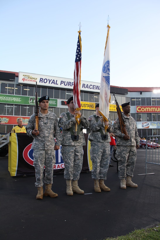In this image released by the Army Reserve's 75th Training Command, soldiers with the unit's Headquarters Company present U.S. and Army flags at a drag racing event in Baytown, Texas, Friday, April 21, 2017. The event, the National Hod Rod Association's Spring Nationals, featured the participation of several Army organizations as part of the service's ongoing recruiting and community relations effort. The 75th Training Command, the senior military headquarters for Houston and the surrounding region, regularly plays a role in events of a public nature. (Photo/75th Training Command, Army Reserve Sgt. 1st Class Danial Lisarelli)