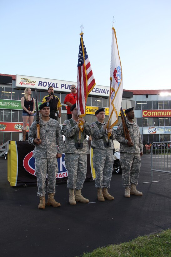 In this image released by the Army Reserve's 75th Training Command, soldiers with the unit's Headquarters Company present U.S. and Army flags at a drag racing event in Baytown, Texas, Friday, April 21, 2017. The event, the National Hod Rod Association's Spring Nationals, featured the participation of several Army organizations as part of the service's ongoing recruiting and community relations effort. The 75th Training Command, the senior military headquarters for Houston and the surrounding region, regularly plays a role in events of a public nature. (Photo/75th Training Command, Army Reserve Sgt. 1st Class Danial Lisarelli)