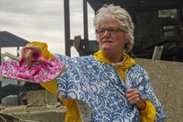 Civilian role player Rita Hyden of North Vernon, Ind., directs emergency responders to others requiring medical attention following a mock nuclear disaster at the Muscatatuck Urban Training Center, April 28, 2017. The U.S. Army Reserve’s Guardian Response 2017 is a multi-component training exercise designed to validate nearly 4,100 service members in Defense Support of Civil Authorities in the event of a Chemical, Biological, Radiological and Nuclear catastrophe. This year's exercise simulated an improvised nuclear device explosion with a source region electromagnetic pulse out to more than four miles. The 84th Training Command hosted this exercise and the 78th Training Division, headquartered in Joint Base McGuire-Dix-Lakehurst, New Jersey, conducted training operations. (U.S. Army Reserve photo by Sgt. Beth Raney, 343rd Mobile Public Affairs Detachment)