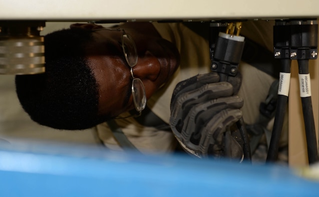 U.S. Air Force Staff Sgt. Stark Sarrazin, a water and fuel systems maintenance craftsman with the 635th Materiel Maintenance Squadron out of Holloman Air Force Base, N.M., plugs up a dryer in a newly-constructed laundry facility in the Dominican Republic, March 29, 2017, as part of NEW HORIZONS 2017. The facility was equipped with 20 dryer units to support approximately 450 Airmen, Soldiers, Marines and Sailors in the Dominican Republic participating in the annual exercise to train military civil engineers and medical professionals to deploy and conduct joint operations. (U.S. Air Force photo by Staff Sgt. Timothy M. Young)