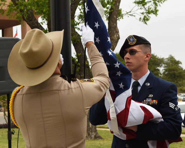 Dyess Honor Guard and 7th Security Forces Squadron Airmen participated in the Peace Officer Flag/Wreath Ceremony in Abilene, Texas, May 3, 2017. The ceremony was held in remembrance of law enforcement officers, including K-9s, across Texas who have died in the line of duty. There were 26 fallen officers honored.