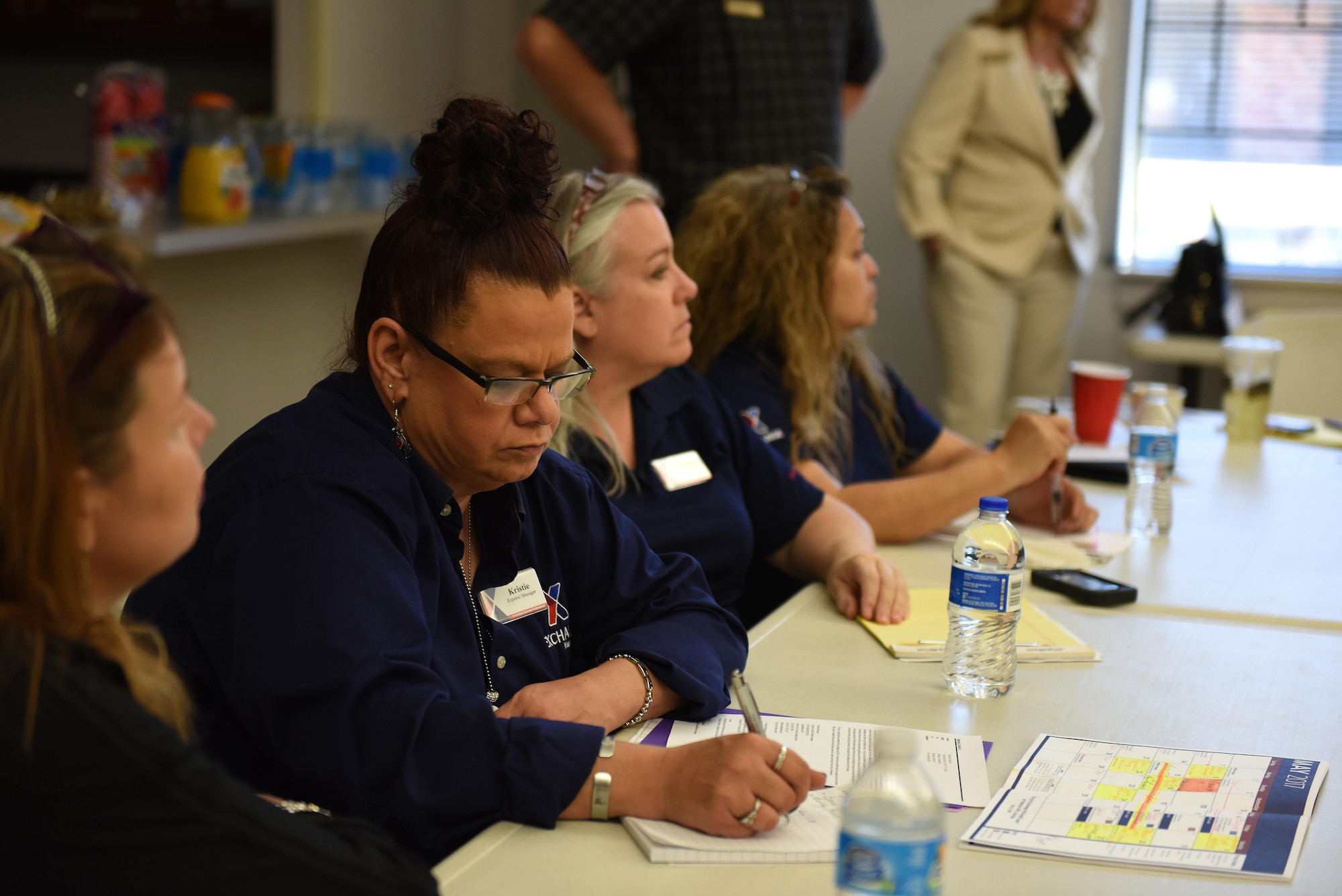 Army and Air Force Exchange Services employees act as subject matter experts during the Caring for People Forum at Taylor Chapel on Goodfellow Air Force Base, Texas, May 4, 2017. The SME’s informed base members of the Exchange’s capabilities and where they stand currently with improvements. (U.S. Air Force photo by Airman 1st Class Caelynn Ferguson/ Released)