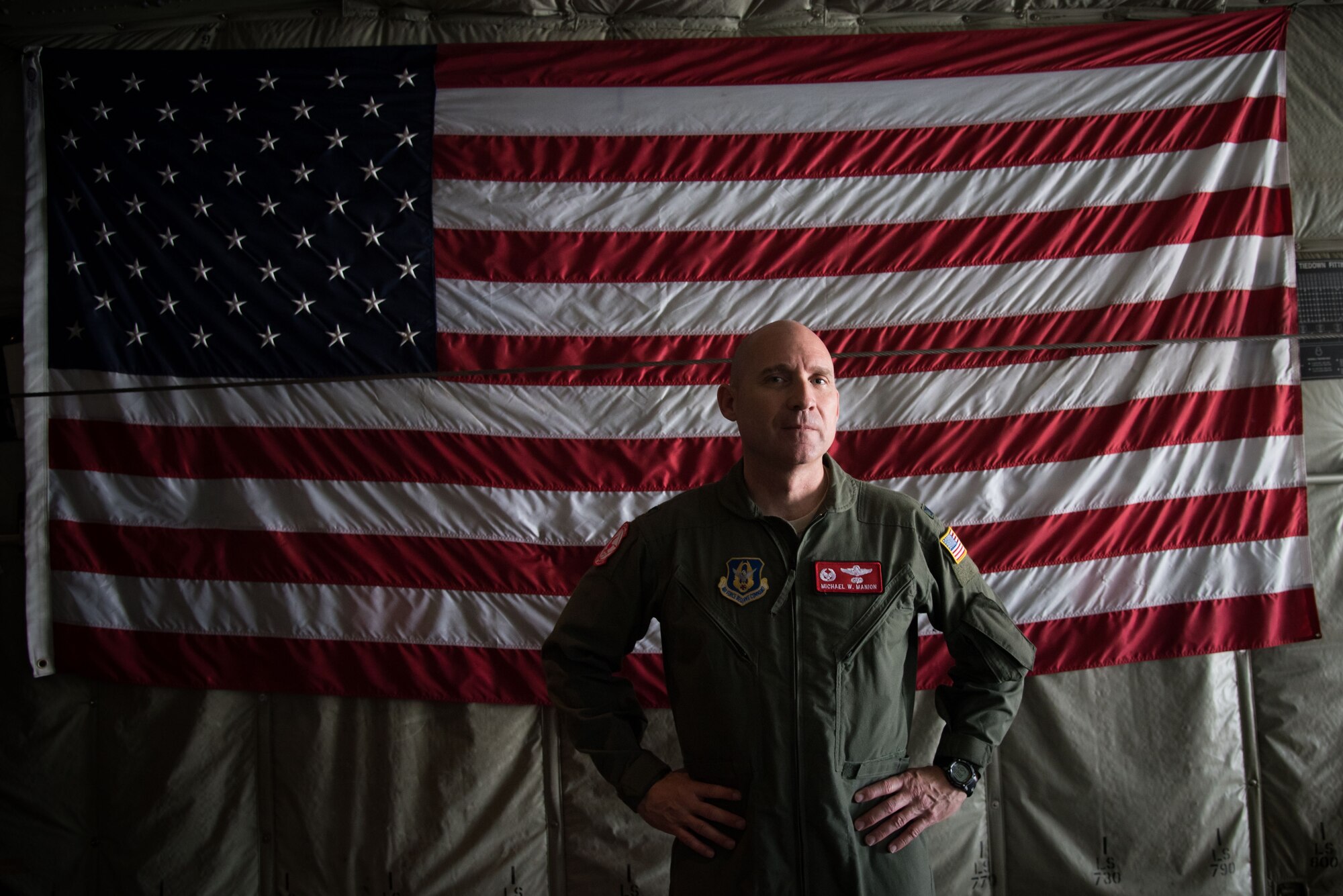 Col. Michael Manion, 403rd Wing Commander poses for a photo in front of an American Flag on a C-130J Super Hercules aircraft during the final flight of his Air Force career May 4, 2017 at Keesler Air Force Base, Mississippi.(U.S. Air Force photo/Staff Sgt. Heather Heiney)