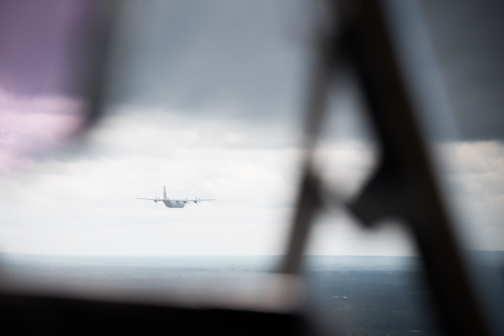 A C-130J Super Hercules aircraft is spotted out the window of a similar aircraft during Col. Michael Manion, 403rd Wing commander's last flight before retirement. (U.S. Air Force photo/Staff Sgt. Heather Heiney)