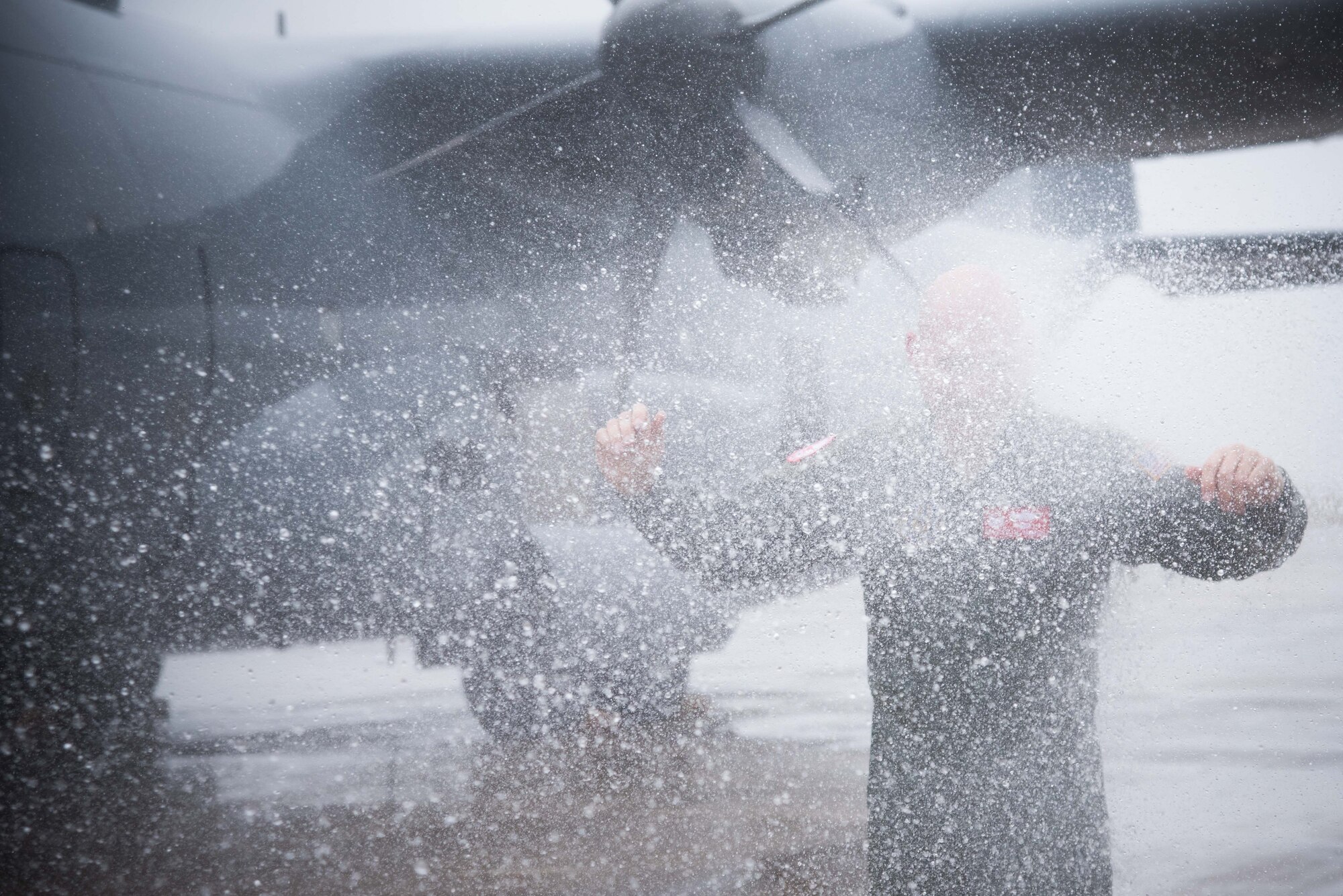 Col. Michael W. Manion, 403rd Wing commander, is sprayed with water after his final flight on a C-130J Super Hercules at Keesler Air Force Base, Mississippi, May 4, 2017.(U.S. Air Force photo/Staff Sgt. Heather Heiney)