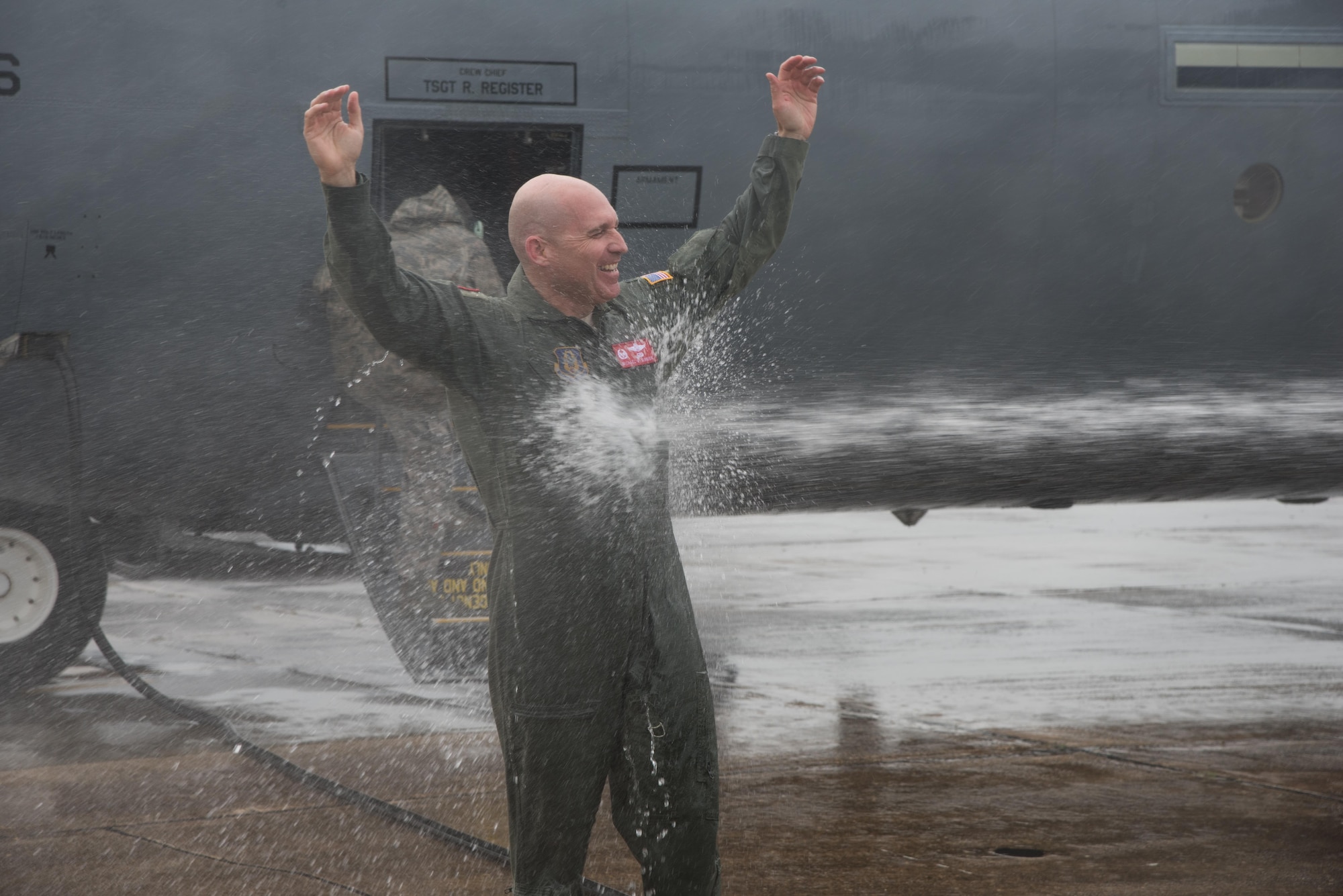 Col. Michael W. Manion, 403rd Wing commander, is sprayed with water after his final flight on a C-130J Super Hercules at Keesler Air Force Base, Mississippi, May 4, 2017.   (U.S. Air Force photo/Maj. Marnee A.C. Losurdo)