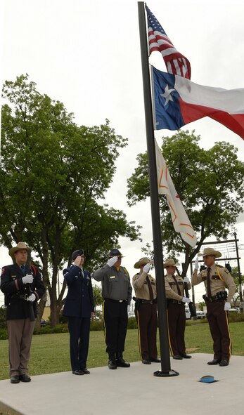 Dyess Honor Guard and 7th Security Forces Squadron Airmen participated in the Peace Officer Flag/Wreath Ceremony in Abilene, Texas, May 3, 2017. The ceremony was held in remembrance of law enforcement officers, including K-9s, across Texas who have died in the line of duty. There were 26 fallen officers honored. (U.S. Air Force photo by Senior Airman Kedesha Pennant)