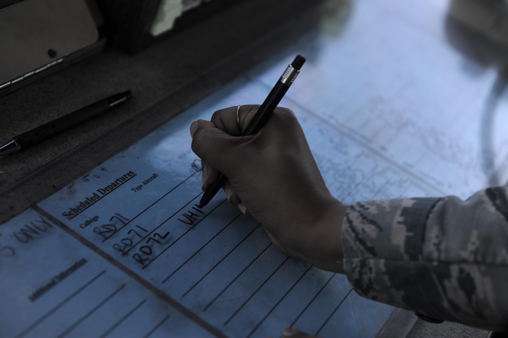 Airman 1st Class Victoria Swain, an air traffic control journeyman with the 1st Special Operations Support Squadron, writes down scheduled departures of aircraft at Hurlburt Field, Fla., May 3, 2017. Air traffic controllers track and supervise aircraft movement on the flight line and in the air. (U.S. Air Force photo by Airman 1st Class Isaac O. Guest IV)