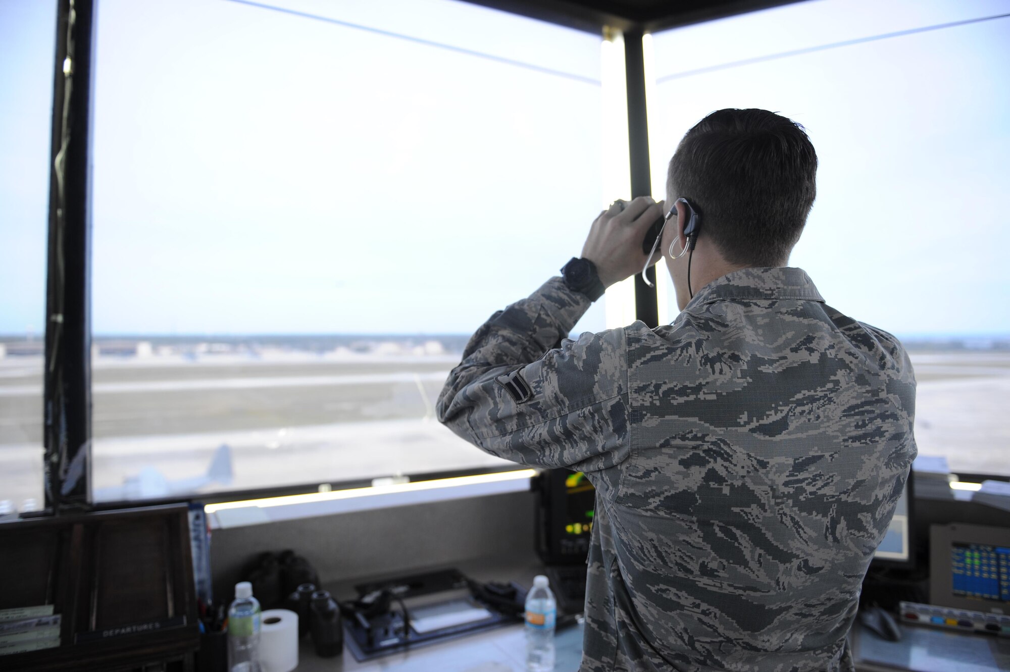 Airman 1st Class Tyler Haley, an air traffic control apprentice with the 1st Special Operations Support Squadron, monitors and communicates with an incoming pilot through a headset at Hulburt Field, Fla., May 3, 2017.  Air traffic controllers provide safe and organized flow of aircraft on the flight line and in the air. (U.S. Air Force photo by Airman 1st Class Isaac O. Guest IV)