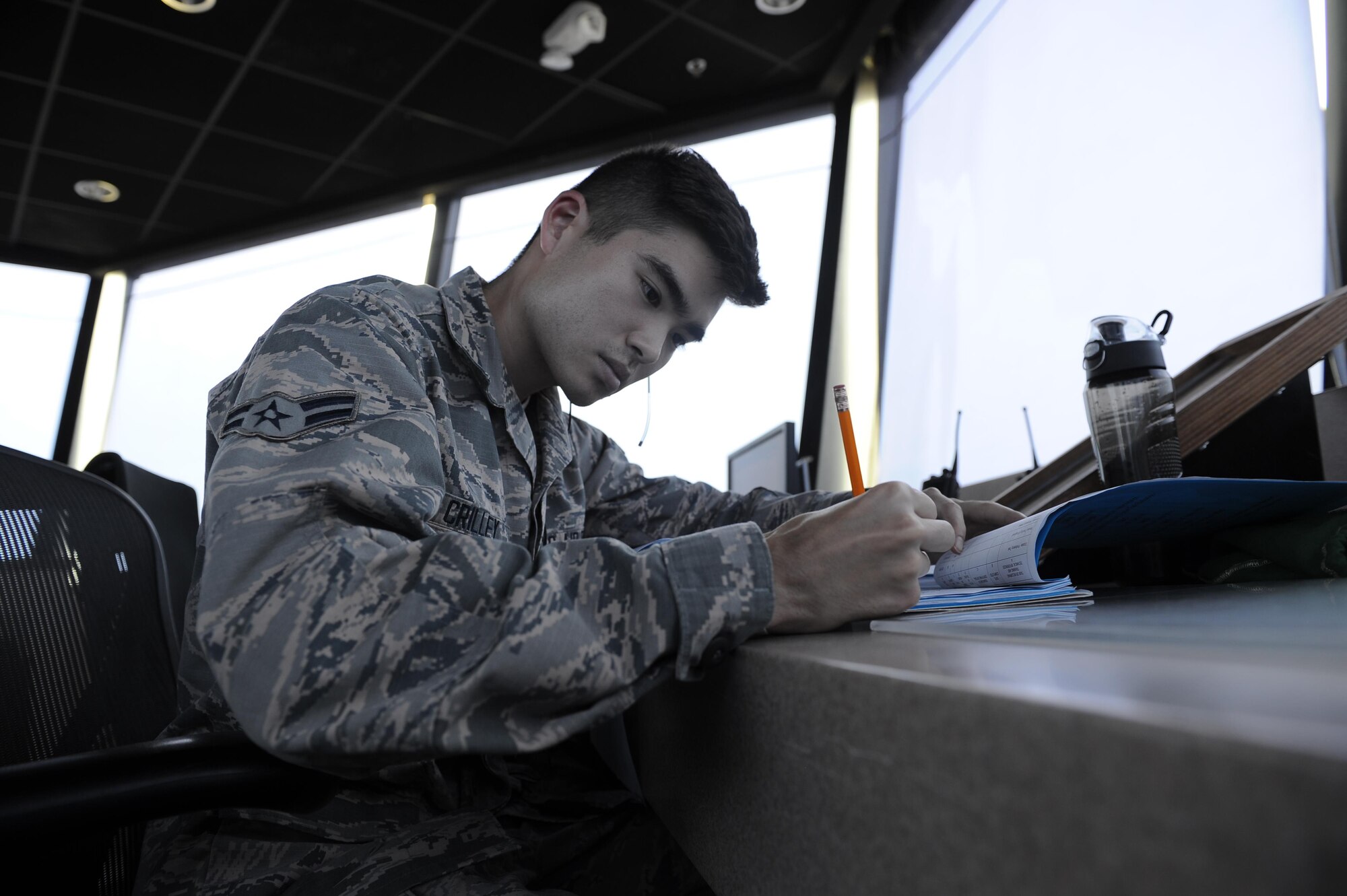 Airman 1st Class Kevin Crilley, an air traffic control apprentice with the 1st Special Operations Support Squadron, reviews his training record at Hurlburt Field, Fla., May 3, 2017. Air traffic controllers provide safe and organized flow of aircraft on the flight line and in the air by monitoring and keeping track of scheduled incoming and departing aircraft. (U.S. Air Force photo by Airman 1st Class Isaac O. Guest IV)