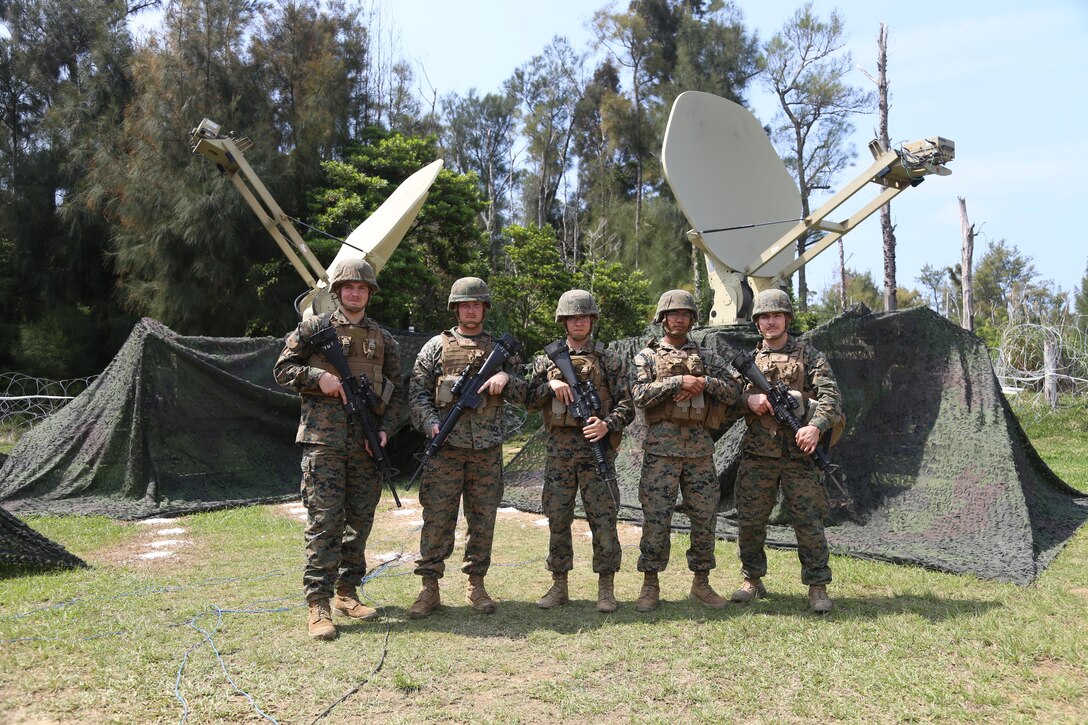 United States Marine Corps satellite communication operators with Company A, 7th Communication Battalion, III Marine Expeditionary Force Headquarters Group set up camp at Camp Hansen, Okinawa, Japan, April 21, 2017, during Marine Expeditionary Force Exercise 17. The command and control exercise prepares III MEF commanders and staff to integrate with international allies and partner nations in a combined joint task force, charged with accomplishing a wide range of military operations. (U.S. Marine Corps Photo By Lance Cpl. Austyn Krecicki/Released)