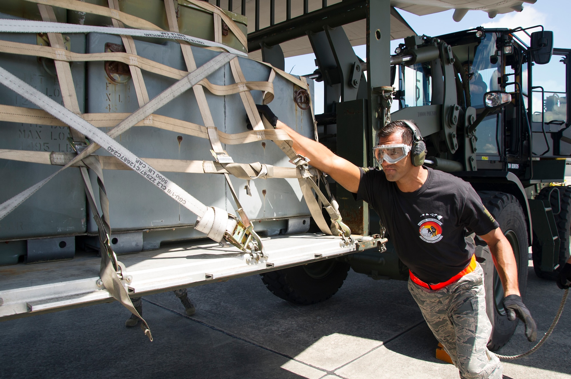 Reserve Citizen Airman Master Sgt. Alfred Van Gieson, of Nanakuli, Hawaii and a member of the 48th Aerial Port Squadron, guides a pallet of equipment onto the C-130 Hercules aircraft during the Port Dawg Challenge at Dobbins Air Reserve Base, Ga., April 25, 2017. The 48th APS, based out of Joint Base Pearl Harbor-Hickam, Hawaii, was one of 23 teams competing in the 4th biennial Air Force Reserve Command's Port Dawg Challenge, which was designed to test and maintain the camaraderie of aerial port Airmen while promoting professionalism, leadership, training and communication between "Port Dawgs." The 48th APS is a component of the Air Force Reserve, providing expertise in all areas of air terminal operations to include aircraft loading, cargo processing and inspecting, passenger services, aircraft fleet services and aerial port command and control. (U.S. Air Force photo by Master Sgt. Theanne K. Herrmann)