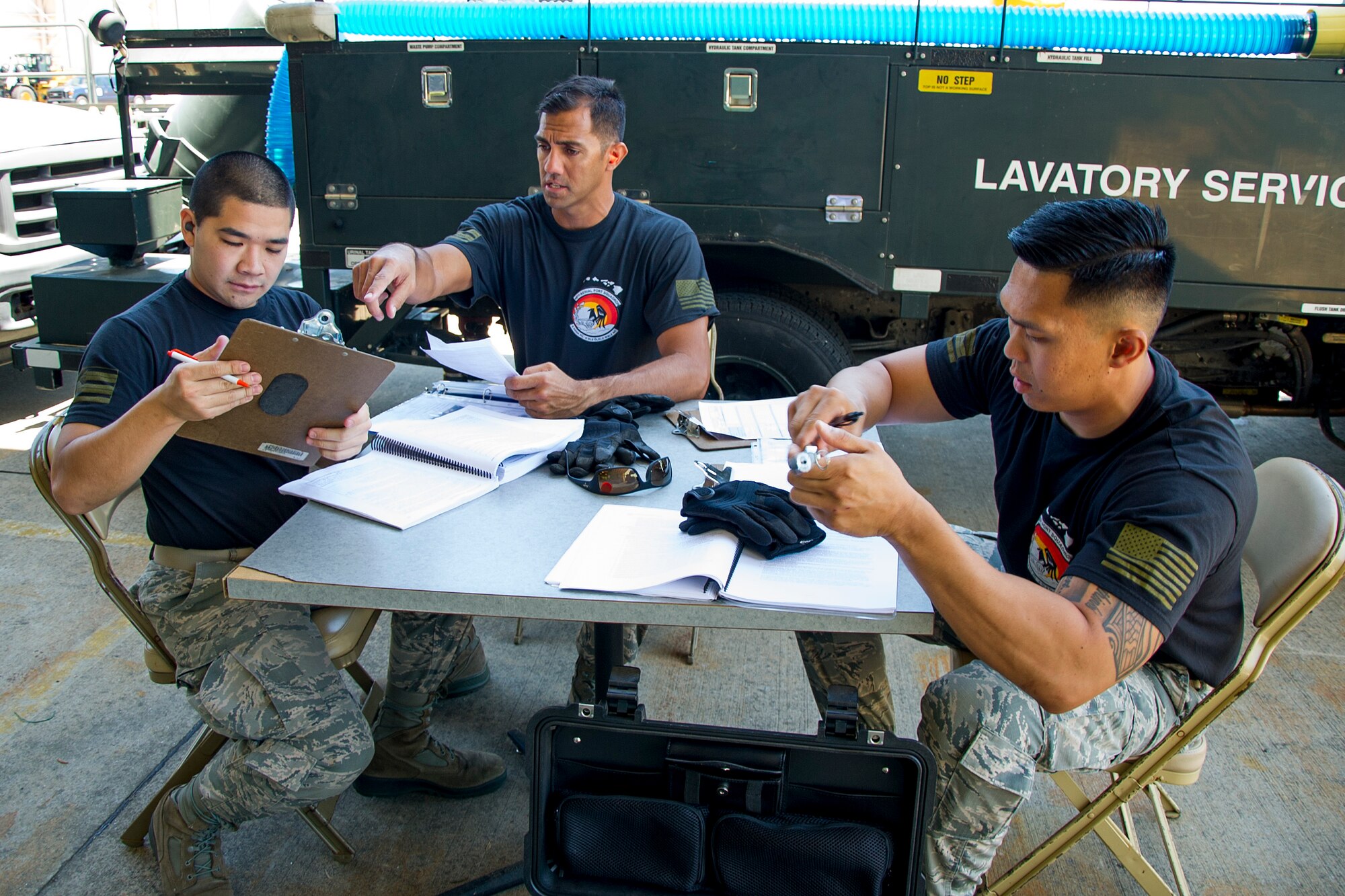 (L-R) Reserve Citizen Airmen Tech. Sgt. Marlon Gibo, Master Sgt. Alfred Van Gieson and Tech. Sgt. Dennis Dedicatoria inventory and inspect forms during the Port Dawg Challenge at Dobbins Air Reserve Base, Ga., April 25, 2017. The 48th Aerial Port Squadron was one of 23 teams competing in the 4th biennial Air Force Reserve Command's Port Dawg Challenge, which was designed to test and maintain the camaraderie of aerial port Airmen while promoting professionalism, leadership, training and communication between "Port Dawgs." The 48th APS, located on Joint Base Pearl Harbor-Hickam, Hawaii, is a component of the Air Force Reserve, providing expertise in all areas of air terminal operations to include aircraft loading, cargo processing and inspecting, passenger services, aircraft fleet services and aerial port command and control. (U.S. Air Force photo by Master Sgt. Theanne K. Herrmann)