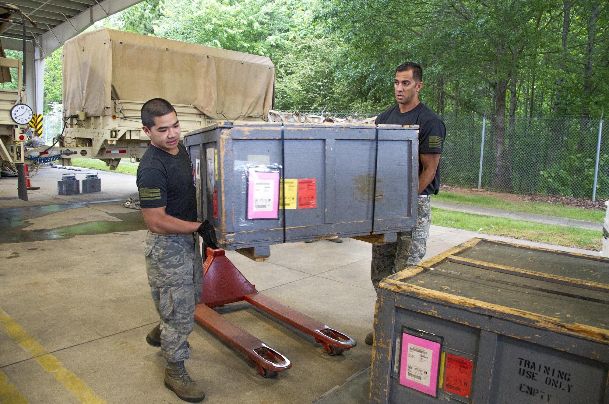 Reserve Citizen Airmen Tech. Sgt. Marlon Gibo, left, and Master Sgt. Alfred Van Gieson, both with the 48th Aerial Port Squadron, load equipment onto a pallet during the Port Dawg Challenge at Dobbins Air Reserve Base, Ga., April 25, 2017.  The 48 APS was one of 23 teams competing in the 4th biennial Air Force Reserve Command's Port Dawg Challenge, which was designed to test and maintain the camaraderie of aerial port Airmen while promoting professionalism, leadership, training and communication between "Port Dawgs." The 48th APS, located on Joint Base Pearl Harbor-Hickam, Hawaii, is a component of the Air Force Reserve, providing expertise in all areas of air terminal operations to include aircraft loading, cargo processing and inspecting, passenger services, aircraft fleet services and aerial port command and control. (U.S. Air Force photo by Master Sgt. Theanne K. Herrmann)