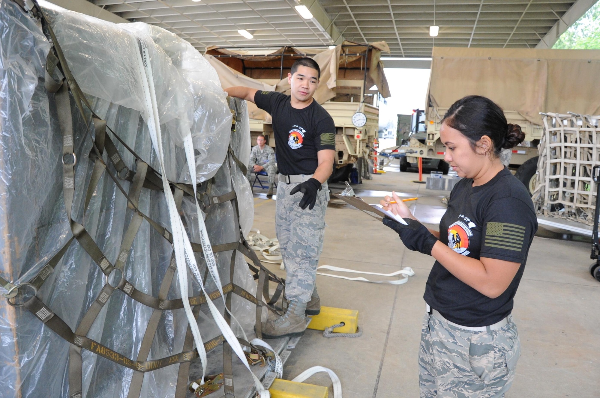 Reserve Citizen Airmen Tech. Sgt. Marlon Gibo, of Honolulu, Hawaii, and Staff Sgt. Amber Picon, of Waipahu, Hawaii, both with the 48th Aerial Port Squadron, inventory equipment being loaded onto a pallet during the Port Dawg Challenge at Dobbins Air Reserve Base, Ga., April 25, 2017. The 48th APS was one of 23 teams competing in the 4th biennial Air Force Reserve Command's Port Dawg Challenge, which was designed to test and maintain the camaraderie of aerial port Airmen while promoting professionalism, leadership, training and communication between "Port Dawgs." The 48th APS, located on Joint Base Pearl Harbor-Hickam, Hawaii, is a component of the Air Force Reserve, providing expertise in all areas of air terminal operations to include aircraft loading, cargo processing and inspecting, passenger services, aircraft fleet services and aerial port command and control. (U.S. Air Force photo by Master Sgt. Theanne K. Herrmann)