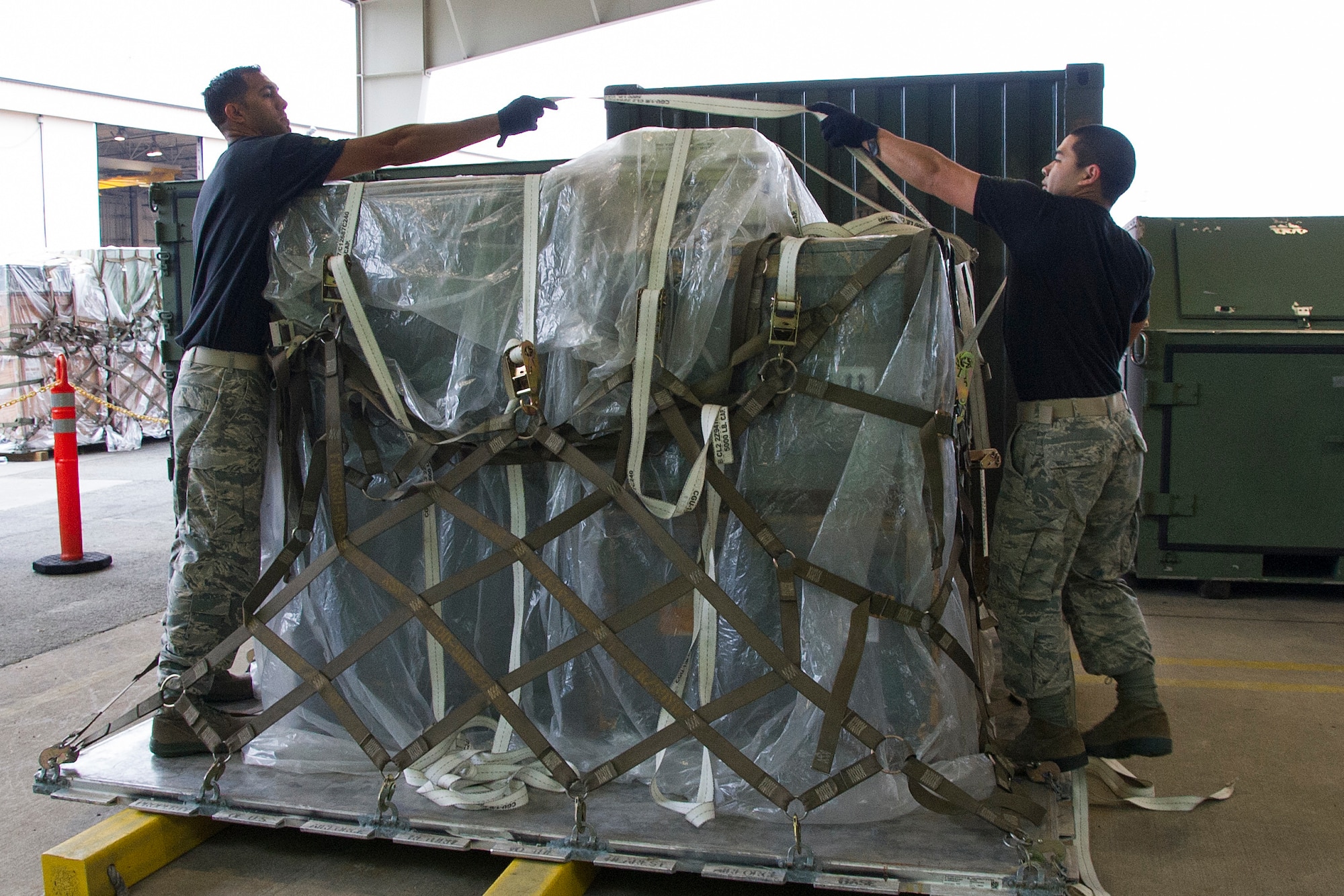 Reserve Citizen Airmen Master Sgt. Alfred Van Gieson, left, of Nanakuli, Hawaii, and Tech. Sgt. Marlon Gibo, of Honolulu, Hawaii, secure equipment onto a pallet during the Port Dawg Challenge at Dobbins Air Reserve Base, Ga., April 25, 2017.  Van Gieson and Gibo, transportation specialists with the 48th Aerial Port Squadron, competed in the 4th biennial Air Force Reserve Command's Port Dawg Challenge, which was designed to test and maintain the camaraderie of aerial port Airmen while promoting professionalism, leadership, training and communication between "Port Dawgs." The 48th APS, located on Joint Base Pearl Harbor-Hickam, Hawaii, is a component of the Air Force Reserve, providing expertise in all areas of air terminal operations to include aircraft loading, cargo processing and inspecting, passenger services, aircraft fleet services and aerial port command and control. (U.S. Air Force photo by Master Sgt. Theanne K. Herrmann)