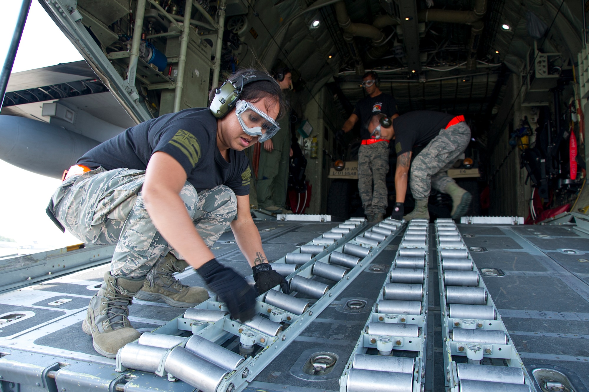 Reserve Citizen Airman Staff Sgt. Amber Picon, of Waipahu, Hawaii, and air transportation specialist with the 48th Aerial Port Squadron, prepares the ramp of a C-130 Hercules aircraft during the Port Dawg Challenge at Dobbins Air Reserve Base, Ga., April 25, 2017. The 48th APS, located on Joint Base Pearl Harbor-Hickam, Hawaii, was one of 23 teams competing in the 4th biennial Air Force Reserve Command's Port Dawg Challenge, which was designed to test and maintain the camaraderie of aerial port Airmen while promoting professionalism, leadership, training and communication between "Port Dawgs." The 48th APS is a component of the Air Force Reserve, providing expertise in all areas of air terminal operations to include aircraft loading, cargo processing and inspecting, passenger services, aircraft fleet services and aerial port command and control. (U.S. Air Force photo by Master Sgt. Theanne K. Herrmann)