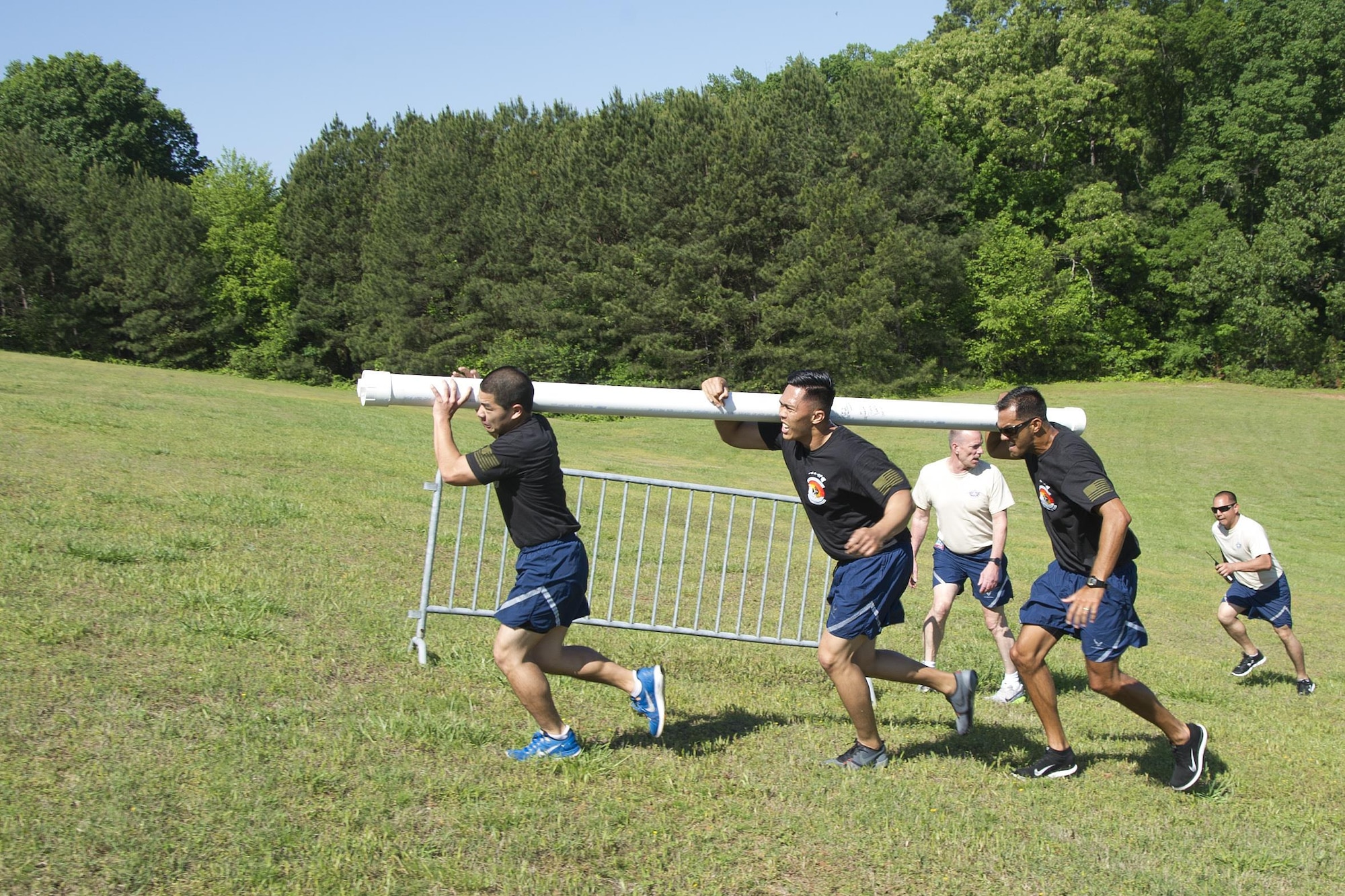 Reserve Citizen Airman Tech. Sgt. Marlon Gibo, Tech. Sgt. Dennis Dedicatoria, and Master Sgt. Alfred Van Gieson, 48th Aerial Port Squadron, work as a team during the fit to fight event at the Port Dawg Challenge, Dobbins Air Reserve Base, Ga., April 26, 2017. The 48th APS was one of 23 teams competing in the 4th biennial Air Force Reserve Command's Port Dawg Challenge, which was designed to test and maintain the camaraderie of aerial port Airmen while promoting professionalism, leadership, training and communication between "Port Dawgs." The 48th APS, located on Joint Base Pearl Harbor-Hickam, Hawaii, is a component of the Air Force Reserve, providing expertise in all areas of air terminal operations to include aircraft loading, cargo processing and inspecting, passenger services, aircraft fleet services and aerial port command and control. (U.S. Air Force photo by Master Sgt. Theanne K. Herrmann)