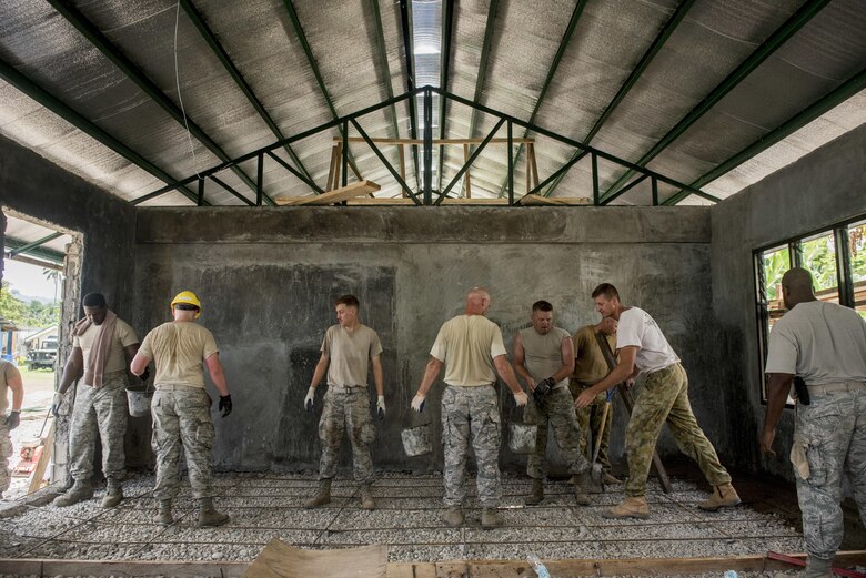 U.S. Airmen and Australian Soldiers pour floor concrete during Balikatan 2017 in Ormoc City, Leyte, April 29, 2017. U.S. military and Australian Army engineers worked together with the Armed Forces of the Philippines to build new classrooms at Margen Elementary School in Ormoc City. Balikatan is an annual U.S.-Philippine bilateral military exercise focused on a variety of missions, including humanitarian assistance and disaster relief, counterterrorism and other combined military operations.  