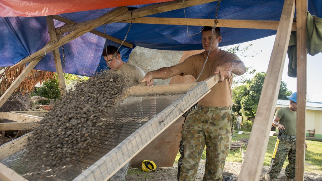 U.S. Air Force Airman 1st Class Nicholas Evans, left, and Australian Army Cpl. Steven Mlinaric screen sand for wall plaster during Balikatan 2017 in Ormoc City, Leyte, April 29, 2017. U.S. military and Australian Army engineers worked together with the Armed Forces of the Philippines to build new classrooms at Margen Elementary School in Ormoc City. Balikatan is an annual U.S.-Philippine bilateral military exercise focused on a variety of missions, including humanitarian assistance and disaster relief, counterterrorism and other combined military operations. 