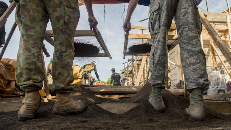 Australian Soldiers and U.S. Airmen screen sand for wall plaster during Balikatan 2017 in Ormoc City, Leyte, April 29, 2017. U.S. military and Australian Army engineers worked together with the Armed Forces of the Philippines to build new classrooms at Margen Elementary School in Ormoc City. Balikatan is an annual U.S.-Philippine bilateral military exercise focused on a variety of missions, including humanitarian assistance and disaster relief, counterterrorism and other combined military operations. 