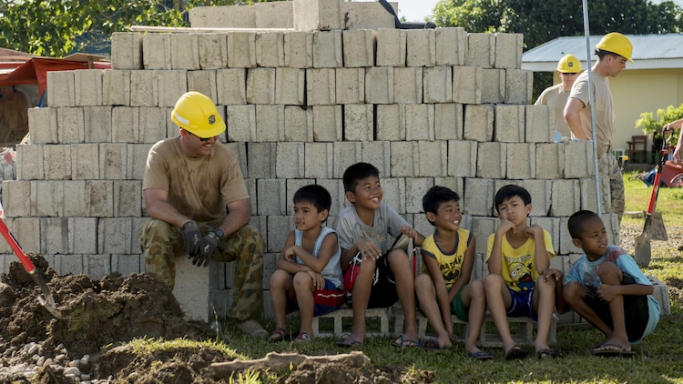 Australian Army Spr. Joshua Park takes a break from construction to spend time with Filipino children during Balikatan 2017 in Ormoc City, Leyte, April 29, 2017. Australian Soldiers and U.S. service members worked together with the Armed Forces of the Philippines to build new classrooms at Margen Elementary School in Ormoc City. Balikatan is an annual U.S.-Philippine bilateral military exercise focused on a variety of missions, including humanitarian assistance and disaster relief, counterterrorism and other combined military operations. 