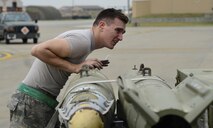 U.S. Air Force Senior Airman Cody Roy, 51st Maintenance Group weapons crew member, inspects munitions during exercise Beverly Herd 17-2 at Osan Air Base, Republic of Korea, May 4, 2017. Exercise Beverly Herd 17-2 was a no-notice readiness exercise designed to ensure Team Osan is ready to “Fight Tonight.” (U.S. Air Force photo by Staff Sgt. Alex Fox Echols III)