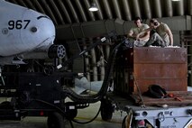 U.S. Air force Staff Sgt. Matthew Mayo and Tech. Sgt. Christopher Leslie, 51st Aircraft Maintenance Squadron weapons load crew members, load ammunition onto an A-10 Thunderbolt during Exercise Beverly Herd 17-2 at Osan Air Base, Republic of Korea, May 5, 2017.  The no-notice exercise challenged the tradition of planning exercises weeks or months in advance, allowing wing leadership a view of how personnel would react in a real-world situation. (U.S. Air Force photo by Airman 1st Class Gwendalyn Smith) 