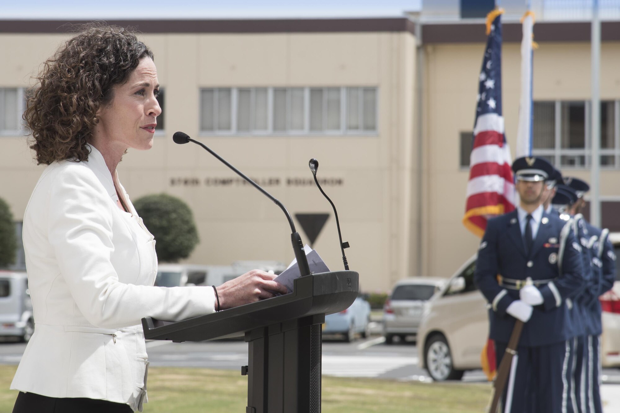 Rebecca English, Defense Finance and Accounting Service Japan deputy director, gives a speech during the ribbon cutting ceremony of the new facility for the 374th Security Forces Squadron and DFAS Japan at Yokota Air Base, Japan, May 3, 2017. DFAS Japan previously occupied two buildings. However, due to a fire employees were relocated to another building in 2009. Now, DFAS Japan is brought together under one roof. (U.S. Air Force photo by Machiko Arita)