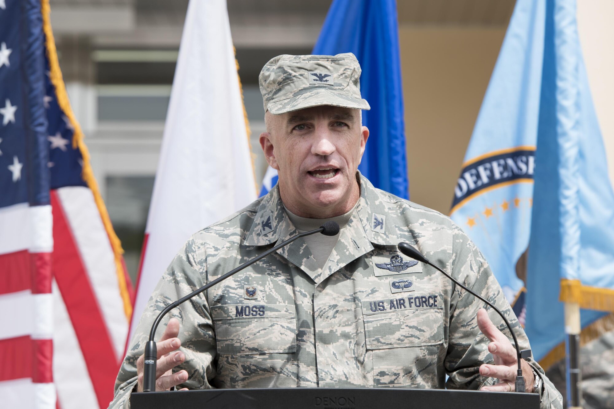 Col. Kenneth Moss, 374th Airlift Wing commander, gives a speech during the ribbon cutting ceremony of the new facility for the 374th Security Forces Squadron and Defense Finance and Accounting Service Japan at Yokota Air Base, Japan, May 3, 2017. The 374 SFS combined twelve functional areas from four separate facilities into one. (U.S. Air Force photo by Machiko Arita)