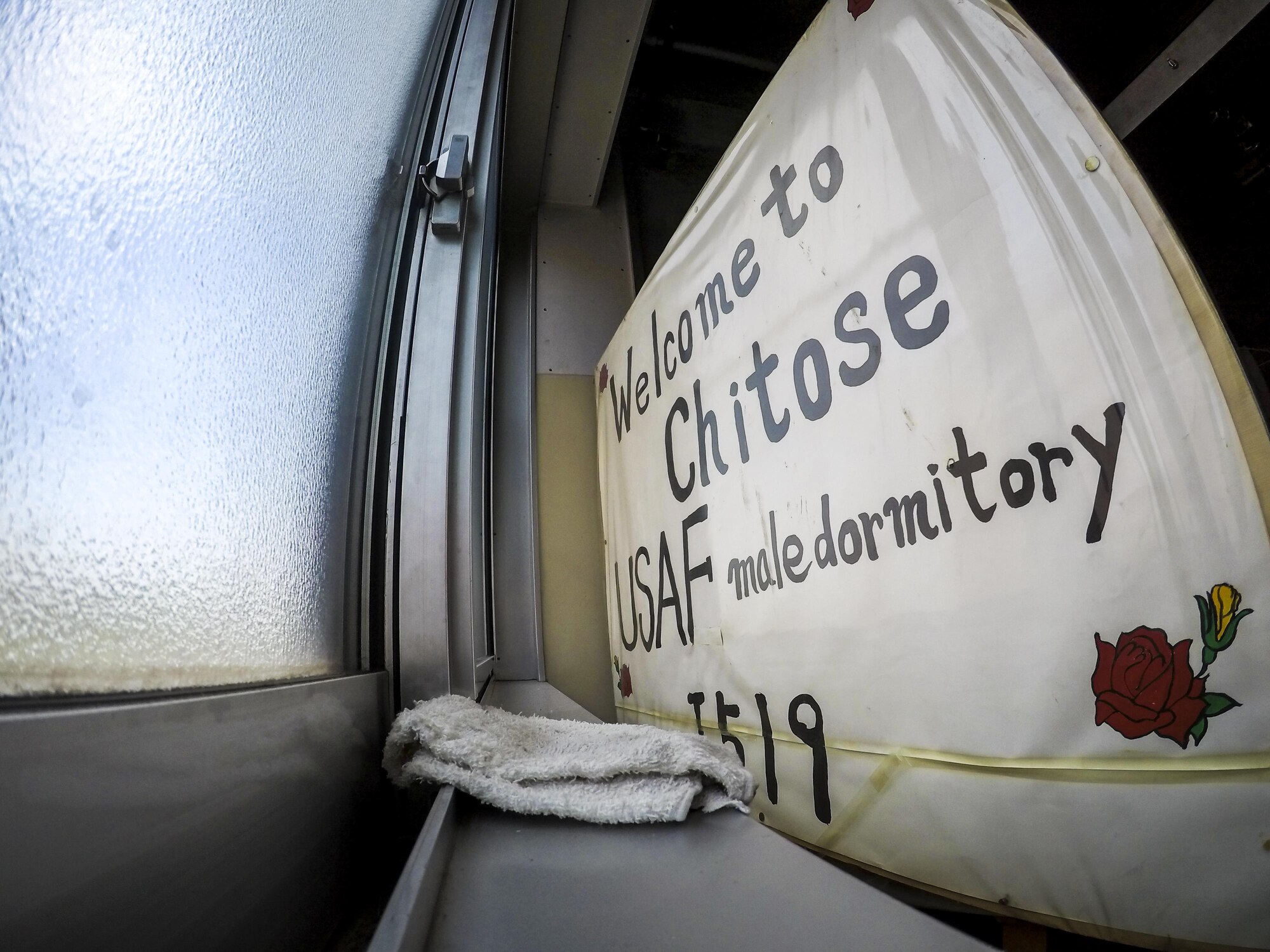 Koku-Jieitai members posted a sign in a first-floor drying room welcoming U.S. Airmen staying in their dormitory during a 10-day U.S.-Japan Bilateral Career Training at Chitose Air Base, Japan, April 15, 2017. Eight males and two females stayed for the duration of the tour April 11-20. The group slept in the Koku-Jieitai dormitories, ate in their dining facility, used their sports and recreation facilities and, most importantly, worked side-by-side with their Japanese counterparts. This sign was just one of many humble and hospitable acts the Japanese made to help the Americans feel welcome and at home. Koku-Jieitai is the traditional term for Japan Air Self Defense Force used by the Japanese. (U.S. Air Force photo by Tech. Sgt. Benjamin W. Stratton)