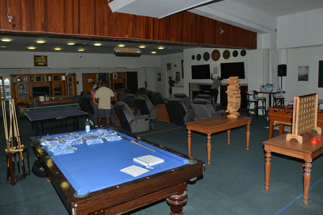 U.S. Airmen prepare the Titans’ Refuge Ministry Center for a grand opening ceremony May 4, 2017, at Incirlik Air Base, Turkey. The Titan’s Refuge houses many amenities, such as video gaming consoles, a ping-pong table, musical equipment and more. (U.S. Air Force photo by Senior Airman John Nieves Camacho)