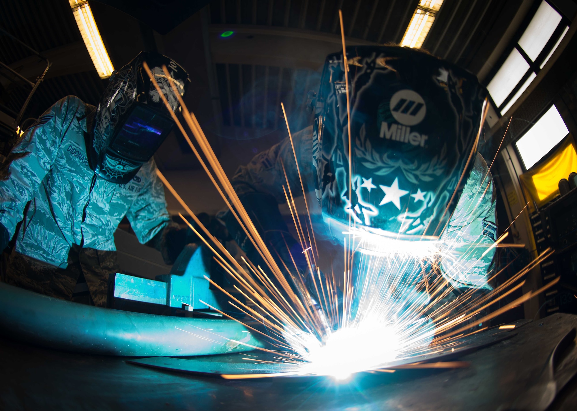 Airman 1st Class Joshua Roth, left, 86th Maintenance Squadron aircraft metals technology technician, uses a metal insert gas welder while Staff Sgt. Brandon Didonato, 86th MXS aircraft metals technology technician, observes on Ramstein Air Base, May 2, 2017. The aircraft metals technology shop uses a MIG welder to create sturdy aircraft parts on demand, allowing aircraft repair and maintenance to continue in a timely manner. (U.S. Air Force photo by Senior Airman Elizabeth Baker/Released)