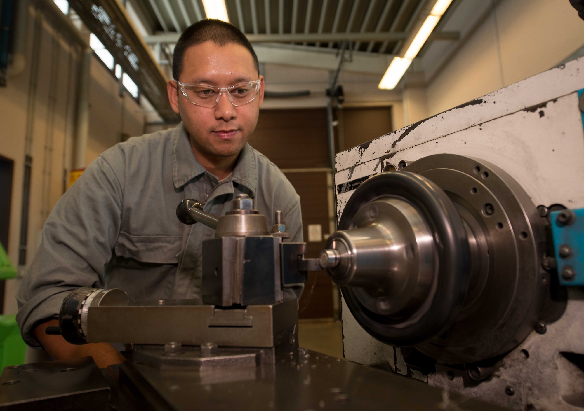 Staff Sgt. Mark Leyva, 86th Maintenance Squadron aircraft metals technology floor supervisor, makes a steel bolt with a lathe at Ramstein Air Base, Germany, May 3, 2017.  The aircraft metals technology shop supports the flight line by creating tools and aircraft parts, including those that may otherwise be difficult or impossible to obtain through purchase because they are too far away or out of production. (U.S. Air Force photo by Senior Airman Elizabeth Baker/Released)