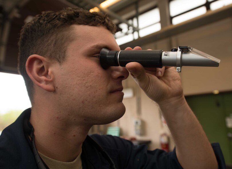 Staff Sgt. Brandon Didonato, 86th Maintenance Squadron aircraft metals technology technician, uses a refractometer to measure the viscosity of coolant oil on Ramstein Air Base, Germany, May 3, 2017. The 86th MXS Aircraft Metals Technology shop welds and machines tools and parts, such as bolts, brackets and exhausts, in support of the flight line. (U.S. Air Force photo by Senior Airman Elizabeth Baker/Released)