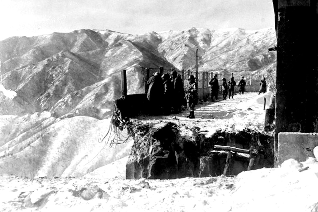 This blown bridge at Funchilin Pass blocked the only way out for U.S. and British forces withdrawing from the Chosin Reservoir in North Korea. Air Force C-119 Flying Boxcars dropped portable bridge sections to span the chasm in December 1950, allowing men and equipment to reach safety. Air Force photo