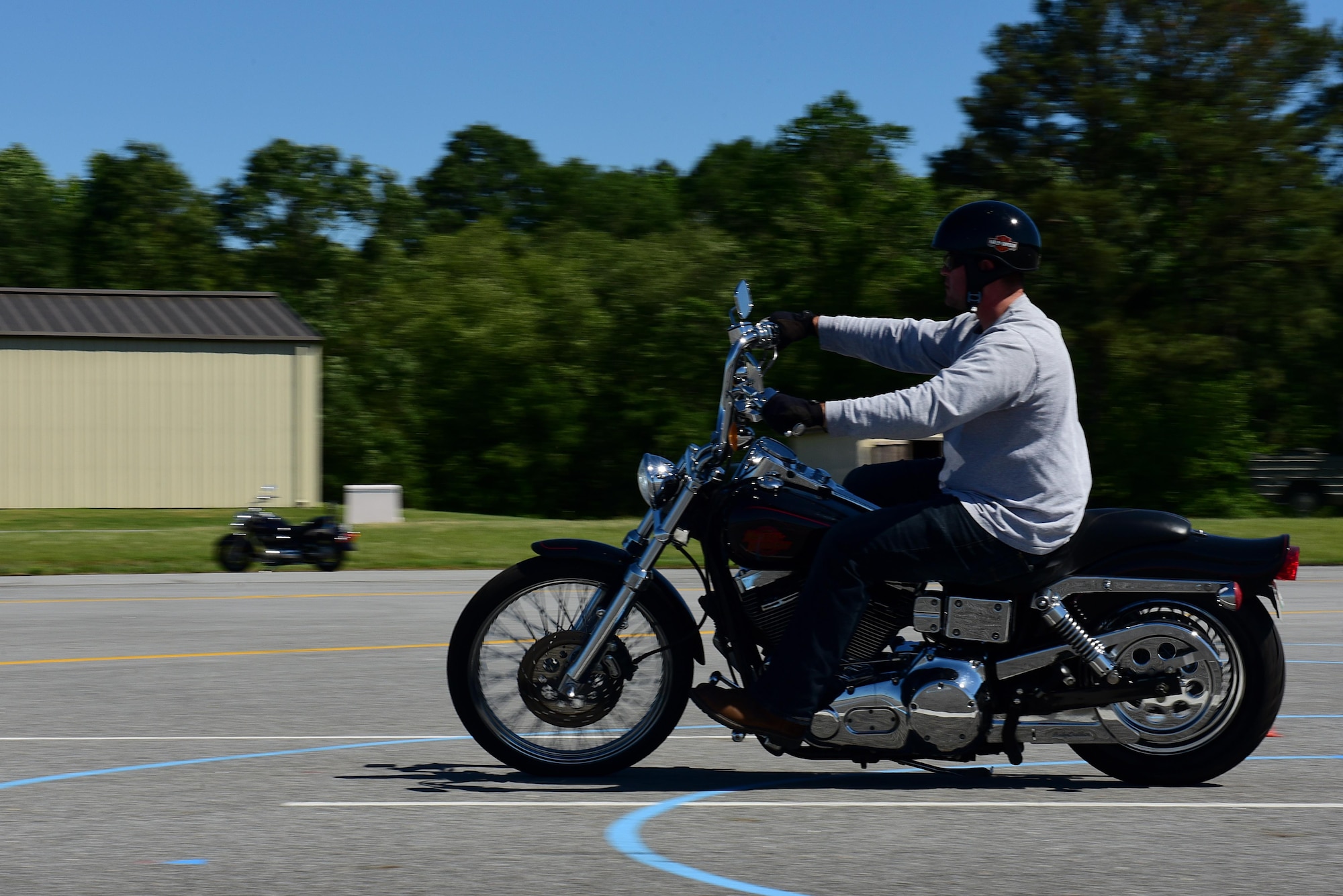 An Airman rides his motorcycle during a motorcycle instructor course, May 2, 2017, at Seymour Johnson Air Force Base, North Carolina. The Airmen are tested rigorously during the course to ensure the people they teach in the future receive the best and most accurate training. (U.S. Air Force photo by Airman 1st Class Kenneth Boyton)