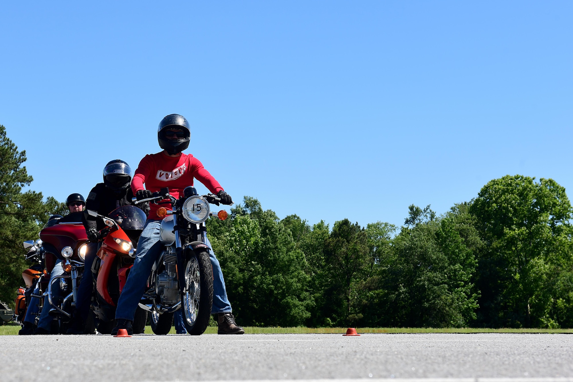 A group of Airmen prepare to ride around a test track as part of a motorcycle instructor course, May 2, 2017, at Seymour Johnson Air Force Base, North Carolina. The Airmen must show proficiency at teaching others in a classroom environment and on the driving range before being certified to teach the Basic Riders Course 2.  (U.S. Air Force photo by Airman 1st Class Kenneth Boyton)