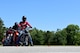 A group of Airmen prepare to ride around a test track as part of a motorcycle instructor course, May 2, 2017, at Seymour Johnson Air Force Base, North Carolina. The Airmen must show proficiency at teaching others in a classroom environment and on the driving range before being certified to teach the Basic Riders Course 2.  (U.S. Air Force photo by Airman 1st Class Kenneth Boyton)