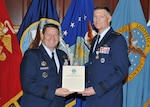 Air Force Gen. Robin Rand (left), Commander, Air Force Global Strike Command, and the service component commander to U.S. Strategic Command, presided over the retirement of DLA Director Air Force Lt. Gen. Andy Busch at DLA Headquarters, Fort Belvoir, Virginia May 4. The two are fellow graduates of the U.S. Air Force Academy Class of 1979. At the ceremony, Rand presented Busch with the Defense Distinguished Service Medal. 