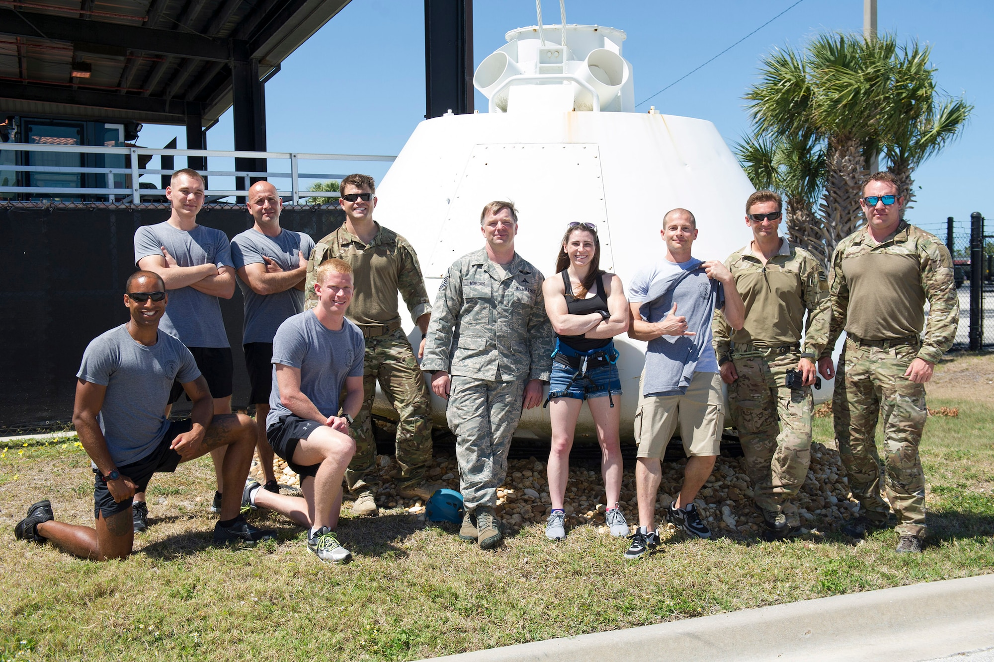 Members of the 308th Rescue Squadron pose with American Ninja Warrior stars Barclay Stockett, center, and Brent Steffensen, third from right, April 21, 2017 after they toured the unit at Patrick Air Force Base, Florida. The television stars visited as part of an Alpha Warrior Military Tour in which they visited with fans the first day and hosted a Ninja Warrior style competition the following day at the base. (U.S. Air Force photo/Phillip Sunkel)

