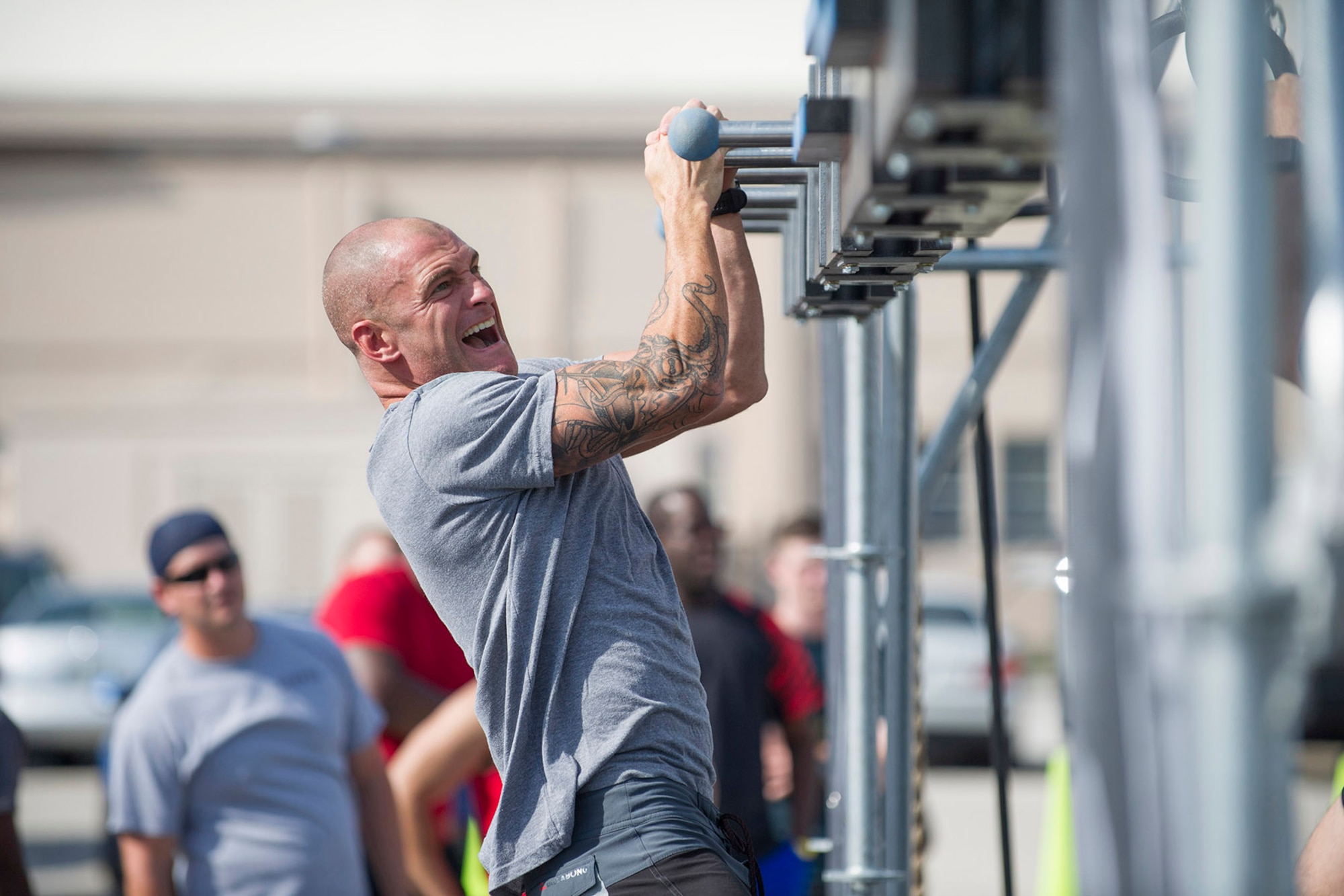 Master Sgt. William Posch, 308th Rescue Squadron pararescueman, works his way through the Alpha Warrior Course April 22, 2017 set up at Patrick Air Force Base, Florida. American Ninja Warrior stars Barclay Stockett and Brent Steffensen hosted the event which included a variety of obstacles to test competitors’ upper body strength and agility. Close to 40 people stepped up to the challenge while a crowd of spectators cheered them on. (U.S. Air Force photo/Phillip Sunkel)