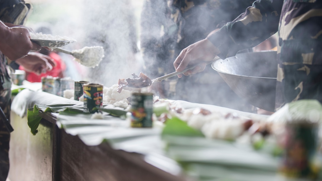 Philippine Soldiers prepare food for a Boodle Fight at a disaster preparedness symposium during Balikatan 2017 in Ormoc City, Leyte, May 2, 2017. A Boodle Fight is a communal meal and Philippine military tradition to symbolize unity and camaraderie. The Armed Forces of the Philippines along with representatives from Japan Self-Defense Force, Australian Defence Force, and U.S. military worked with a local barangay to improve health conditions and disaster preparedness.Balikatan is an annual U.S.-Philippine bilateral military exercise focused on a variety of missions, including humanitarian assistance and disaster relief, counterterrorism, and other combined military operations. 