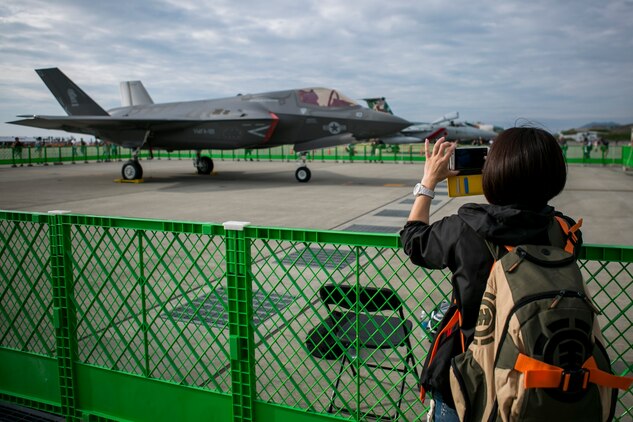 A Japanese local takes a picture of a U.S. Marine Corps F-35B Lightning II static display during the 41st Japan Maritime Self-Defense Force – Marine Corps Air Station Iwakuni Friendship Day at MCAS Iwakuni, Japan, May 5, 2017.Since 1973, MCAS Iwakuni has held a single-day air show designed to foster positive relationships and offer an elevating experience that displays the communal support between the U.S. and Japan. The air show also encompassed various U.S. and Japanese static aircraft displays, aerial performances and demonstrations, food and entertainment. (U.S. Marine Corps photo by Lance Cpl. Tiana Boyd)