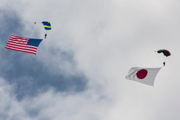 Evolve Aerosports executes a flag jump during the 41st Japan Maritime Self-Defense Force – Marine Corps Air Station Iwakuni Friendship Day at MCAS Iwakuni, Japan, May 5, 2017. Since 1973, MCAS Iwakuni has held a single-day air show designed to foster positive relationships and offer an elevating experience that displays the communal support between the U.S. and Japan. The air show also encompassed various U.S. and Japanese static aircraft displays, aerial performances and demonstrations, food and entertainment. (U.S. Marine Corps photo by Lance Cpl. Christian J. Robertson)