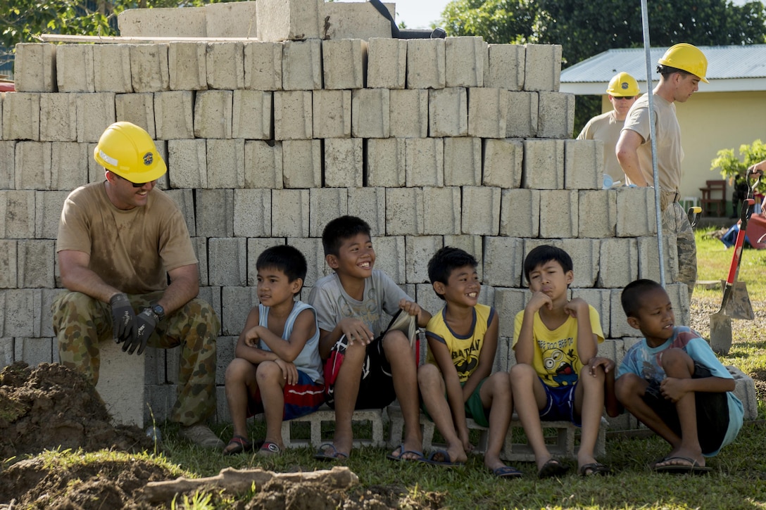 Australian Army Spr. Joshua Park spends time with children while taking a break from a classroom construction project at Margen Elementary School in Ormoc City, Philippines, April 29, 2017, as part of exercise Balikatan 2017. Air Force photo by Staff Sgt. Peter Reft