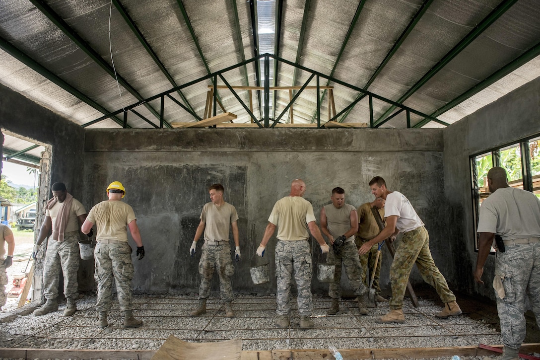 U.S. airmen and Australian soldiers pour concrete for a classroom floor at Margen Elementary School in Ormoc City, Philippines, April 29, 2017, as part of exercise Balikatan 2017. Balikatan is an annual U.S.-Philippine military exercise that includes humanitarian assistance and disaster relief; counterterrorism; and other combined military operations. Air Force photo by Staff Sgt. Peter Reft