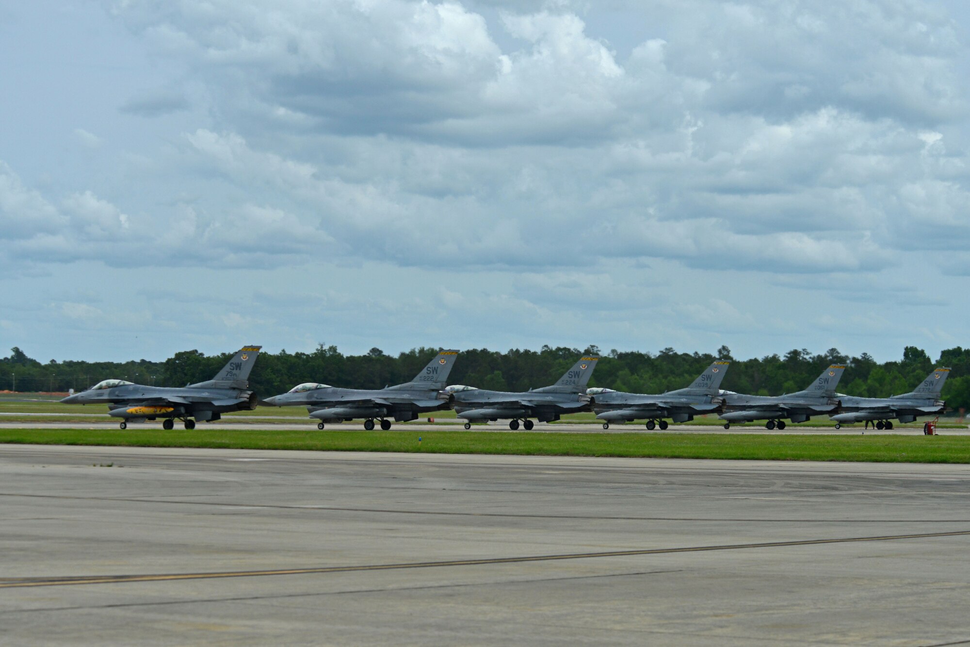 Pilots assigned to the 79th Fighter Squadron (FS) wait to taxi their F-16CM Fighting Falcons down the flightline at Shaw Air Force Base, S.C., May 4, 2017 after a six-month deployment to Bagram Airfield, Afghanistan. The 79th FS and the 20th Aircraft Maintenance Squadron deployed to Bagram Airfield, Afghanistan, in support of Operation Freedom’s Sentinel. (U.S. Air Force photo by Airman 1st Class Destinee Sweeney)